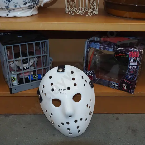 boxed Nightmare on Elm St figurine - box has damage, plastic hockey mask, Tasmanian tiger in plastic cage