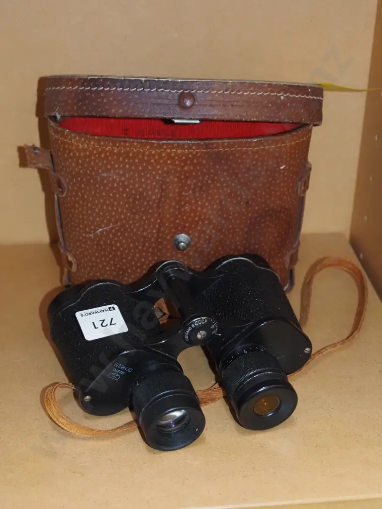 pair of field binoculars in leather case Image 1++