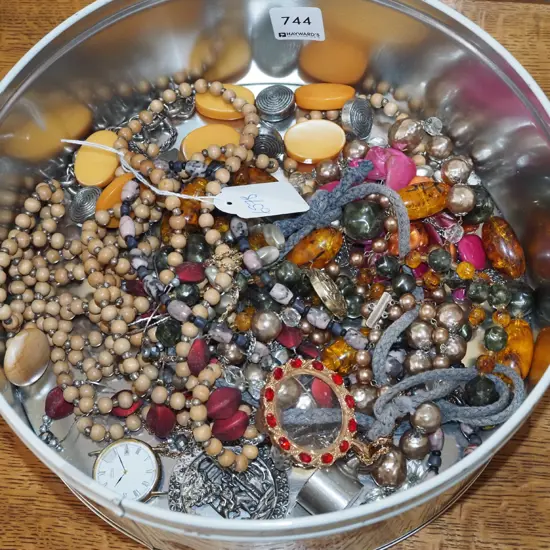 tin of costume jwellwey