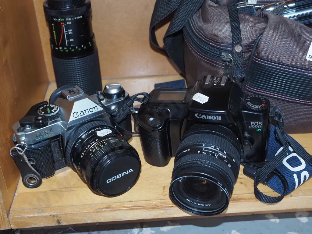 Canon AE-1 and Canon EOS 1000F 35mm SLR film cameras, additional lens, tripod & carry bag Image 1++