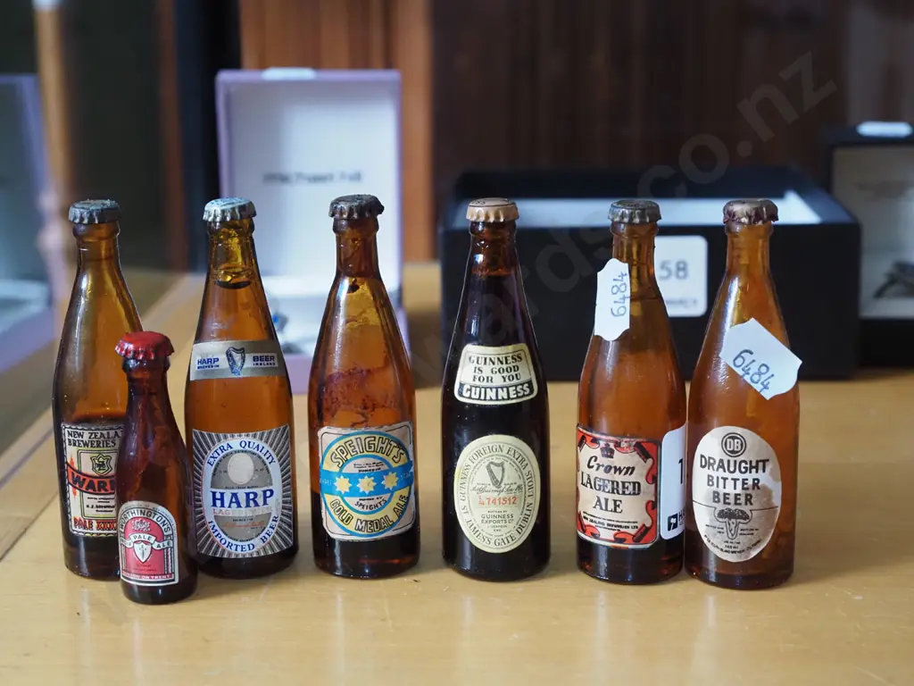 7 miniature beer bottles Image 1++