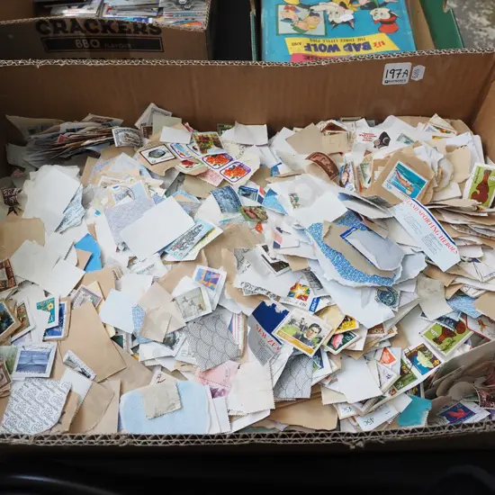 box of loose postage stamps