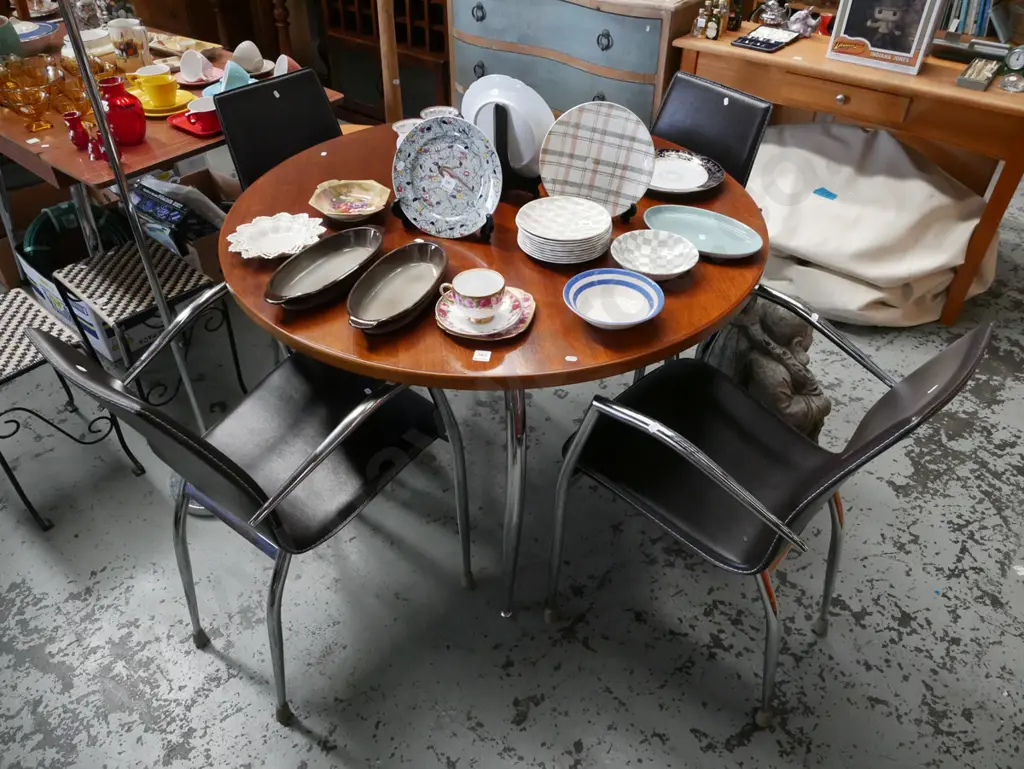 circular chrome based glass top dining table with 4 matching vinyl chairs - glass top table has mahogany Image 1++