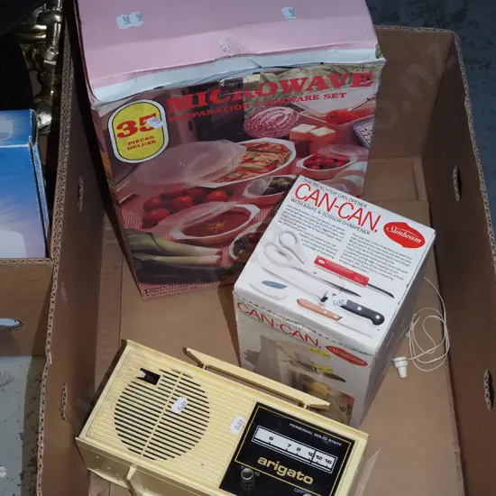 box; microwave cookware set, electric can opener, plastic mantle radio