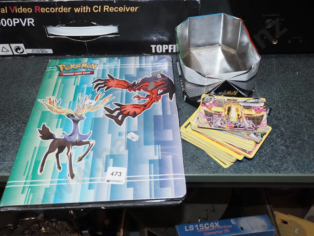 Pokemon cards in tin and album Image 1++