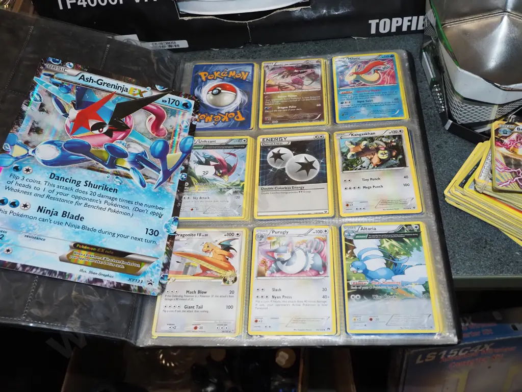 Pokemon cards in tin and album Image 1++