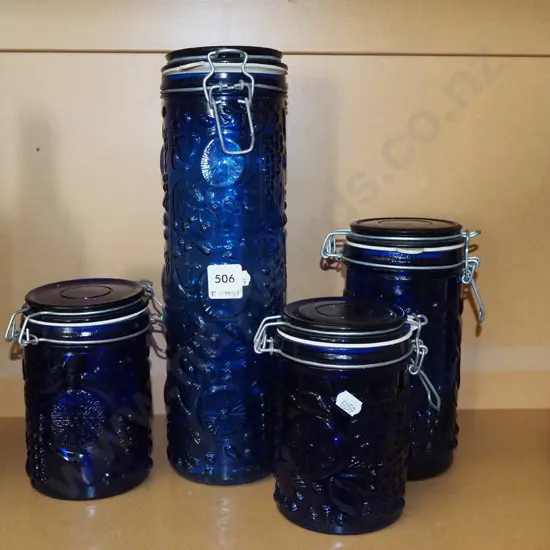 4x blue embossed glass storage canisters Tallest H330