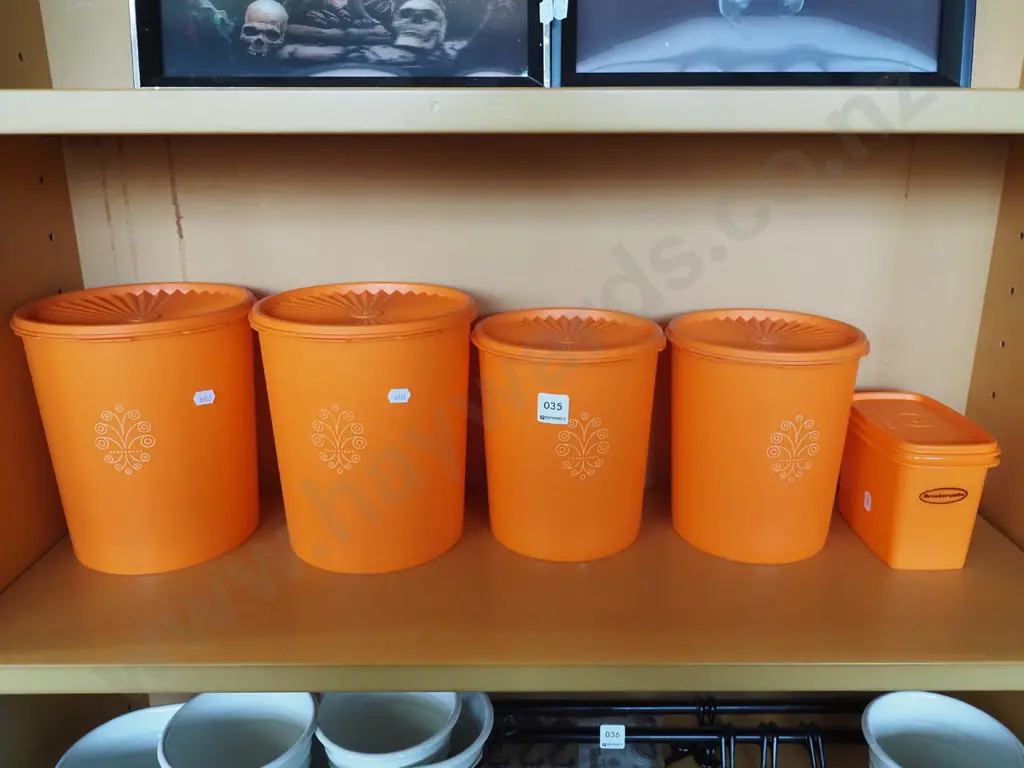 shelf of vintage Tupperware storage containers Image 1++