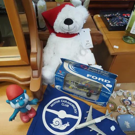 teddy bear, caravan club pennant, papa smurf figurine etc