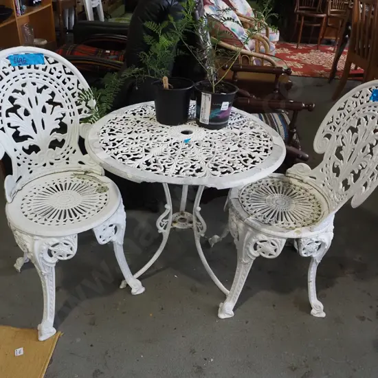 cast alloy patio table with 2 chairs - paint needs attention, chips to rim of table