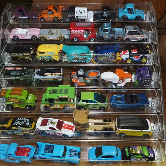 Hotwheels die-cast vehicles in clear plastic display stand