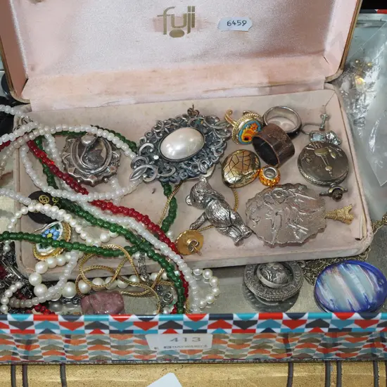 tin of costume jewellery
