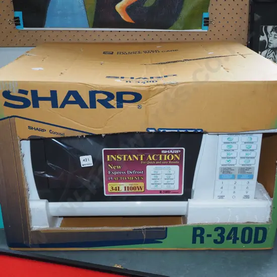 boxed as new Sharp Carousel microwave
