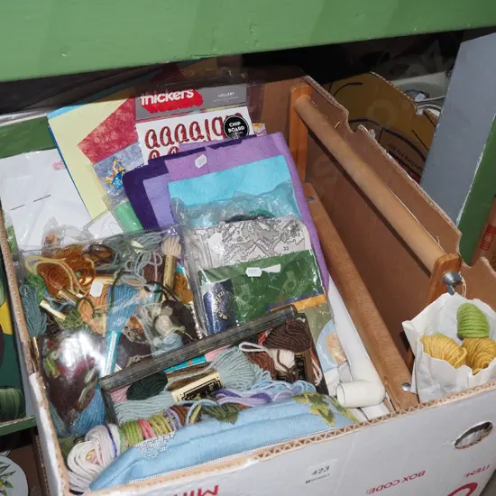 box; needlework threads, patterns, paper, frames etc