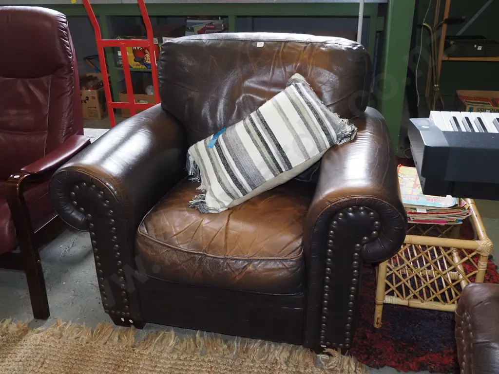 brown leather rolled arm armchair with dome studding on front - some wear to leather Image 1++