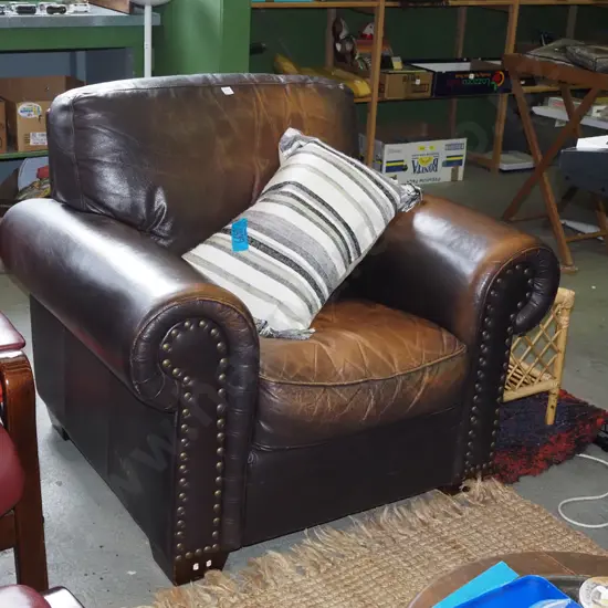 brown leather rolled arm armchair with dome studding on front - some wear to leather
