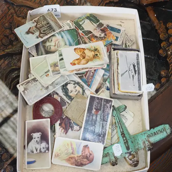 cast metal Boeing plane and cigarette collector cards