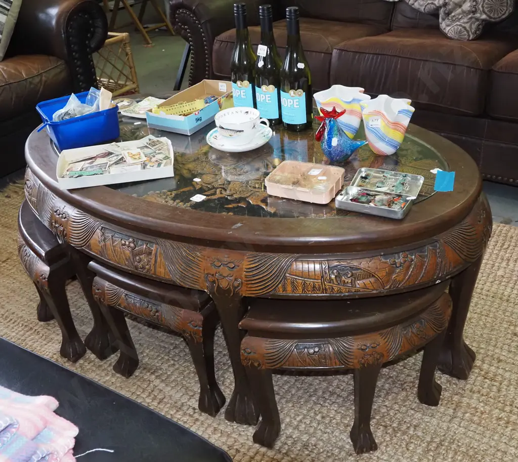 Chinese low oval dining table, heavily carved battle scene under glass with 6 matching pull out stools H500 W1250 D780 Image 1++