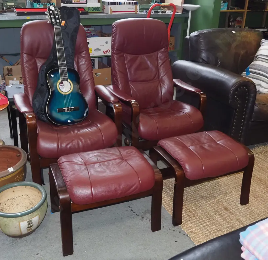 pair of burgundy leather reclining armchairs with matching footstools Image 1++