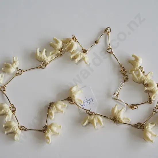 necklace, plastic elephants on chain