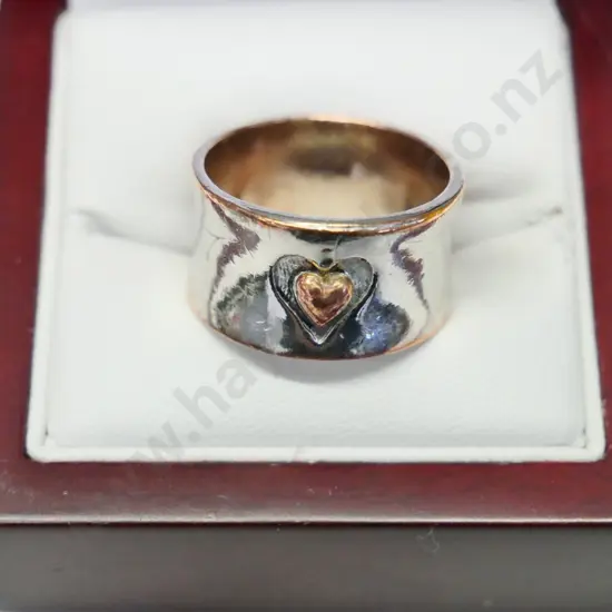 silver ring with small heart design stamped S925