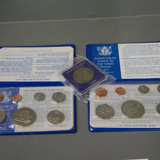 New Zealand collector coins: 1978 and 1979 souvenir sets and a 1978 cased dollar