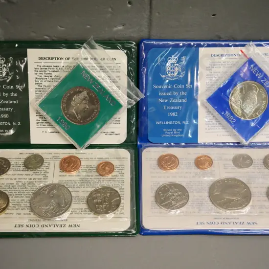 Cased New Zealand coin sets - 1980 and 1982 souvenir sets with dollar, and 2 individual dollars