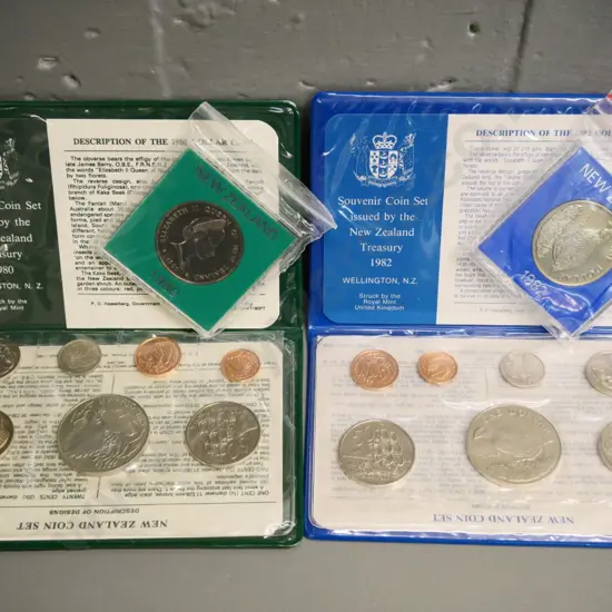 Cased New Zealand coin sets - 1980 and 1982 souvenir sets with dollar, and 2 individual dollars