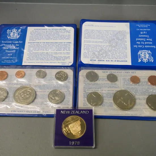 New Zealand collector coins: 1978 and 1979 souvenir sets and a 1978 cased dollar