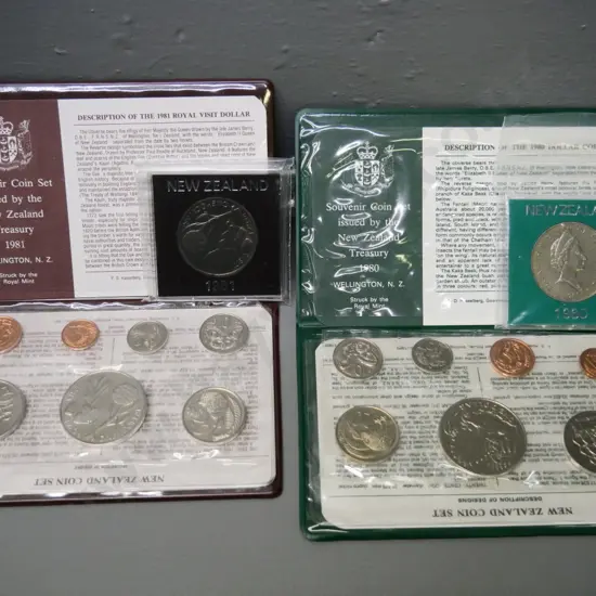 Cased New Zealand coin sets - 1980 and 1981 - souvenir sets with dollar and individual dollars