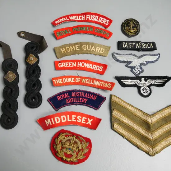 assorted military cloth cap and shoulder badges, stripes and epaulettes - British, German, Australian, etc.