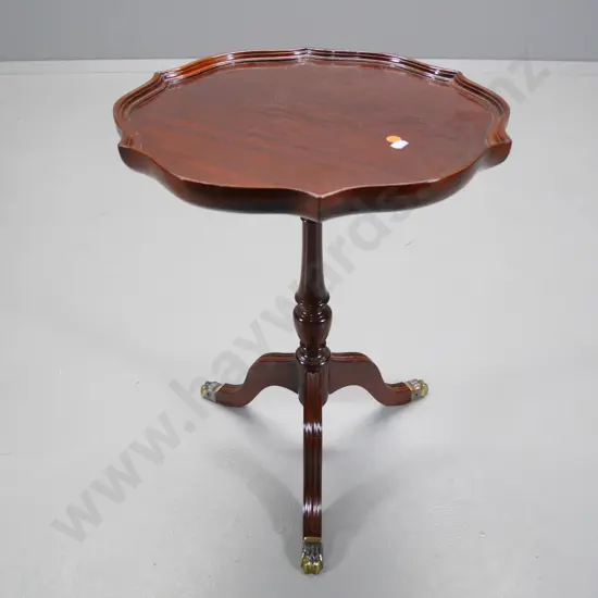 mahogany round wine table on column-base w/pie-crust edge, brass claw feet, fine ridges in top veneer or finish H540