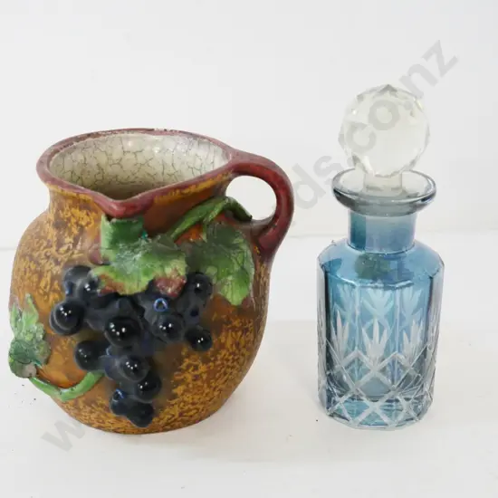 small Amphora jug with raised grapes - minor chip - and a blue glass stoppered scent bottle H-120