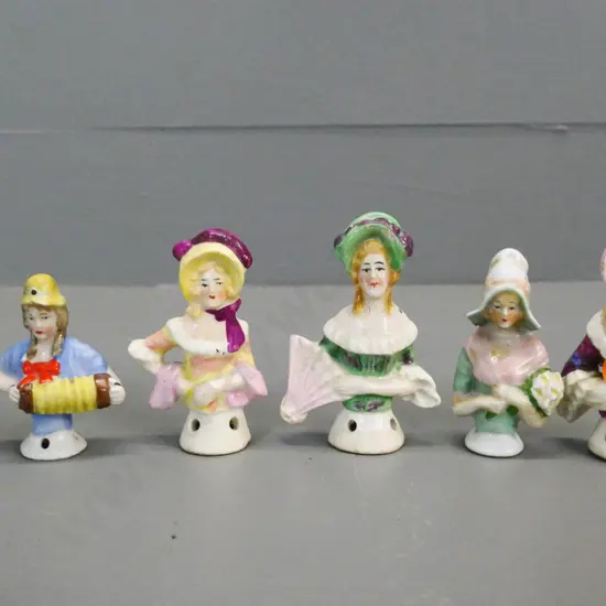 6 small china half-dolls, one with chip to hat, tallest is H-70