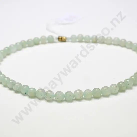 light coloured greenstone bead necklace