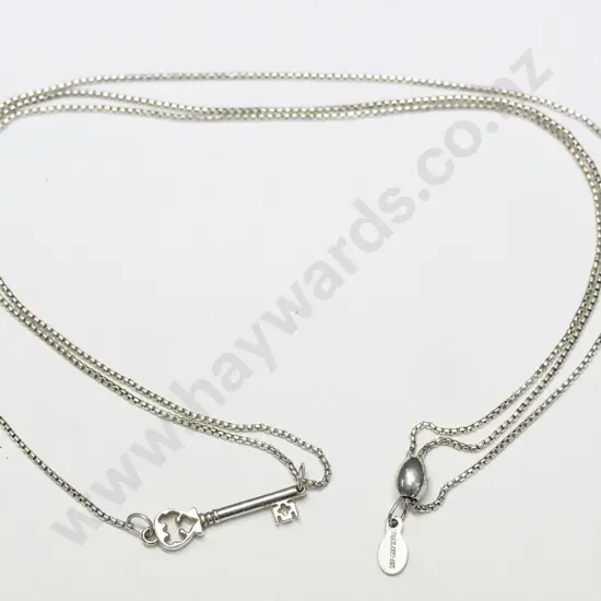 silver necklace stamped Patent Pending