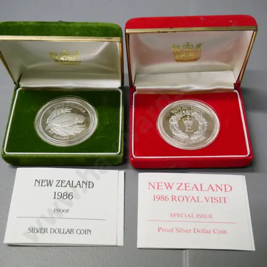 2 cased New Zealand cased 1985 proof dollar coins - kakapo and Royal Visit