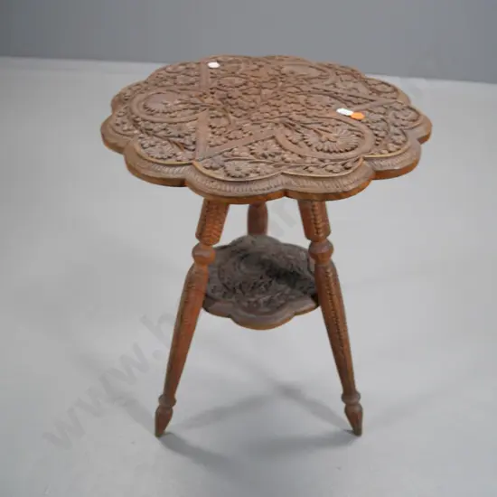 carved wood round occasional table with Persian style motifs - some movement in tripod base H-530 Diameter 370