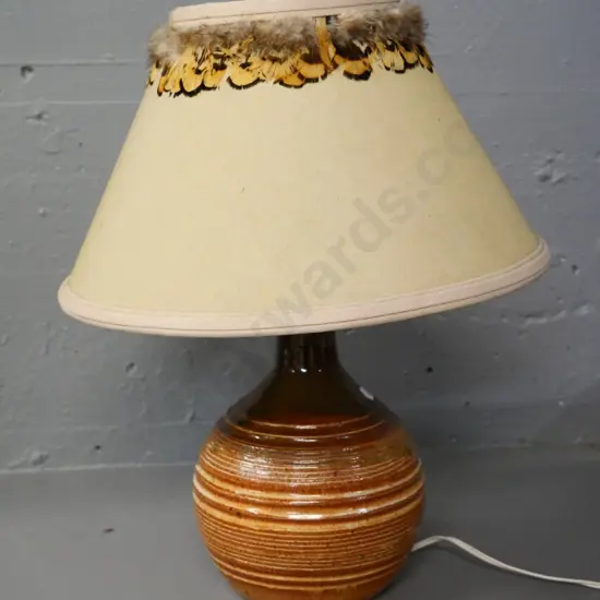 pottery based table lamp with feather-trimmed shade, cork stopper holdling fitting. H-410, diameter 320