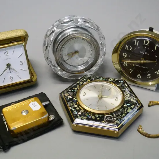 4 retro small travel or bedside clocks, paua front design has broken stand, and a Henselite bowls measure