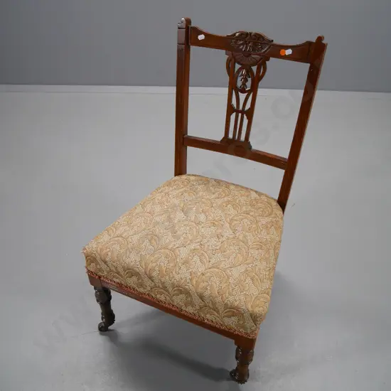 Edwardian carved back nursing chair with damask upholstered seat, on original casters - some movement H-770 W-450 D-430