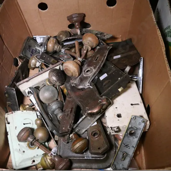 box of vintage door hardware