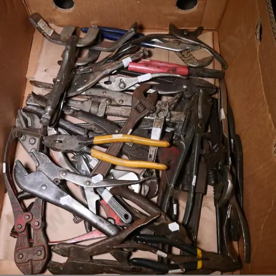 box of pliers, vise grips, plumber's wrenches, etc.