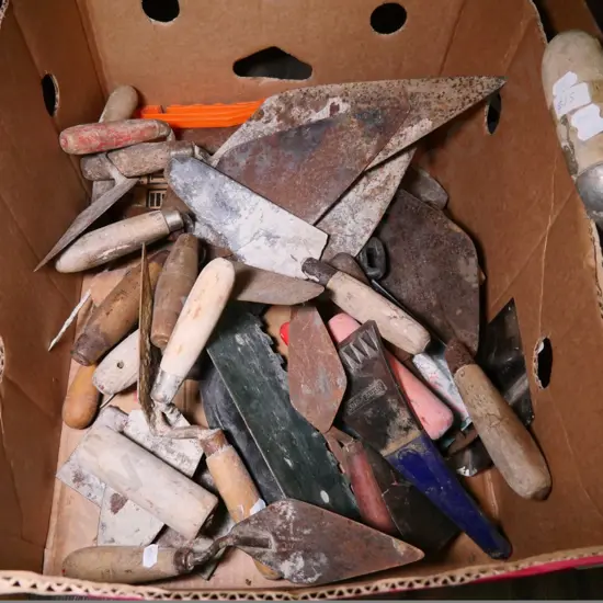 box of rusty plastering floats