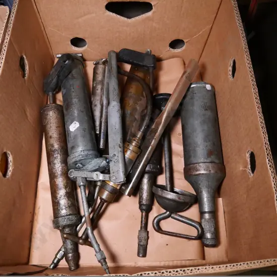 box of grease guns
