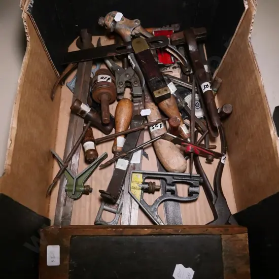 box of builder's squares, sharpening stones, nibblers, etc.