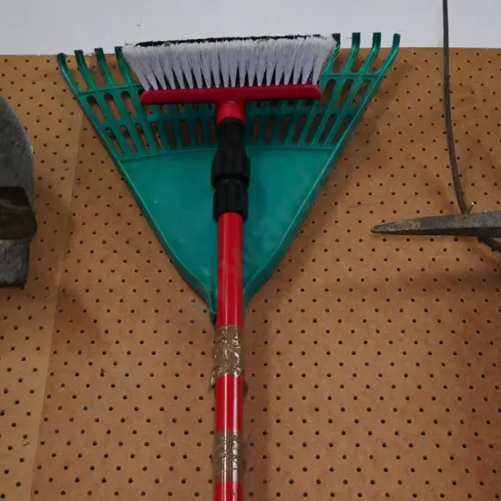grass rake and a telescopic window brush