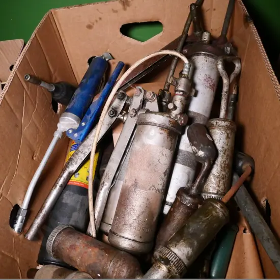 box of grease guns