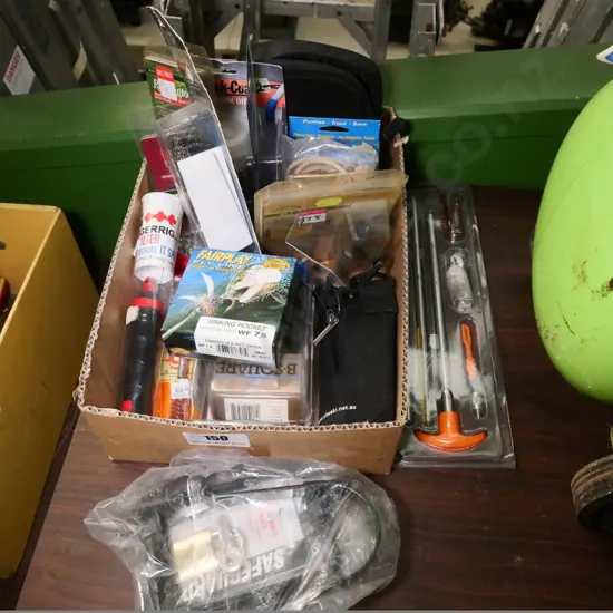 box of various hunting and fishing accessories