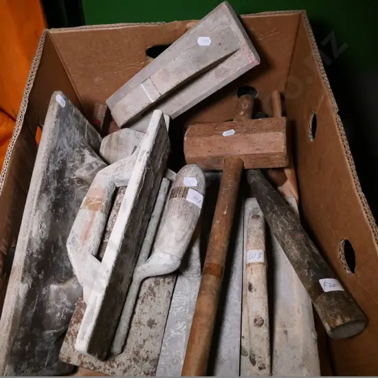 box of wooden plastering floats, mallets, etc.